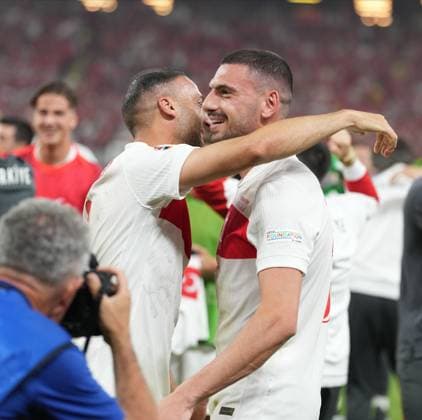 Turkiye s players Cenk Tosun and Merih Demiral celebrate their team victory after UEFA EURO, EM, Europameisterschaft,Fussball 2024 Group F football match between Turkiye and Czechia at Volksparkstadion in Hamburg, Germany, on 26 June, 2024. (Mehmet Sirin Toplaoglu - Depo Photos) 18364705