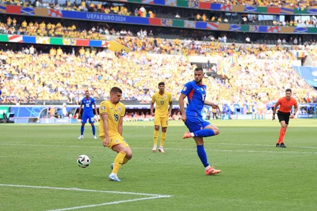 Football - UEFA EURO, EM, Europameisterschaft,Fussball 2024 - Group E - Slovakia v Romania 26th June 2024 - UEFA EURO 2024 - Group E - Slovakia v Romania - David Hancko of Slovakia clips the ball past Razvan Marin of Romania - Photo: Simon Stacpoole Offside. Frankfurt Germany Copyright: xSimonxStacpoolexOffside