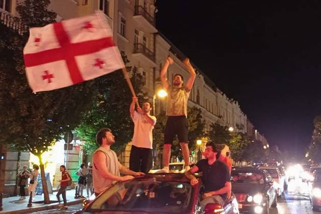 GEORGIA, TBILISI - JUNE 27, 2024: Football fans celebrate Georgiaâ€™s victory over Portugal in their UEFA EURO, EM, Europameisterschaft,Fussball 2024 Group F match. Georgiaâ€™s national team, Nationalteam won 2-0 to secure qualification to the knockout stages of the tournament. Inna Kukudzhanova TASS  0701935791st