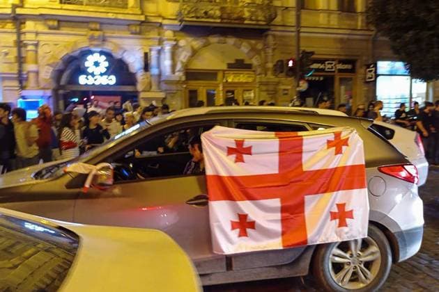 GEORGIA, TBILISI - JUNE 27, 2024: Football fans celebrate Georgiaâ€™s victory over Portugal in their UEFA EURO, EM, Europameisterschaft,Fussball 2024 Group F match. Georgiaâ€™s national team, Nationalteam won 2-0 to secure qualification to the knockout stages of the tournament. Inna Kukudzhanova TASS  0701943437st