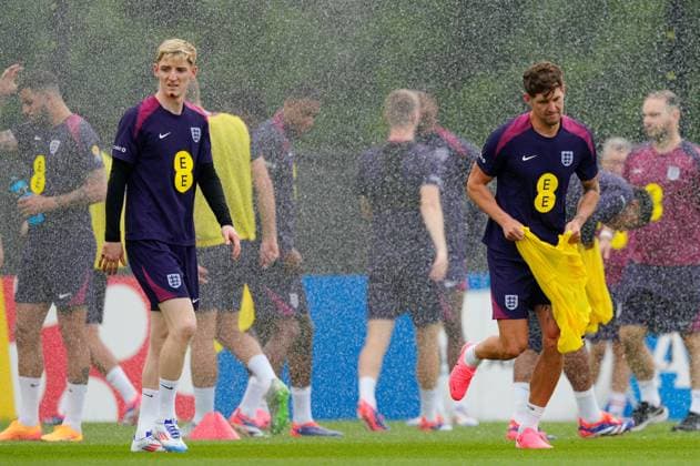Anthony Gordon and John Stones of England try to avoid sprinklers England Training, UEFA European Championship, EM, Europameisterschaft 2024, Football, Spa & Golf Resort Weimarer Land, Blankenhain, Germany, 27 Jun 2024 EDITORIAL USE ONLY No use with unauthorised audio, video, data, fixture lists, club league logos or live services. Online in-match use limited to 120 images, no video emulation. No use in betting, games or single club league player publications. Copyright: xDavexShopland Shutterstockx 14559245cw