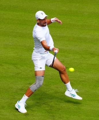 Novak Djokovic practices on Centre Court wearing a knee support Wimbledon Tennis Championships, Practice and Previews, The All England Lawn Tennis and Croquet Club, London, UK - 27 Jun 2024  Copyright: xJavierxGarcia Shutterstockx 14560174w