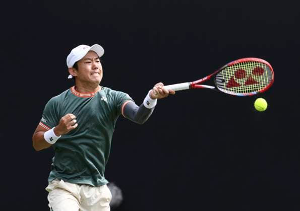 27th June 2024; Devonshire Park, Eastbourne, East Sussex, England: Rothesay International Eastbourne, Day 4; Yoshihito Nishioka (JPN) plays a forehand against Aleksandar Vukic (AUS) in the quarter finals match  ActionPlus12661083 HongboxChen