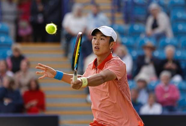 27th June 2024; Devonshire Park, Eastbourne, East Sussex, England: Rothesay International Eastbourne, Day 4; Juncheng Shang (CHN) plays a forehand against Taylor Fritz (USA) in the mens quarter-final match  ActionPlus12661139 HongboxChen