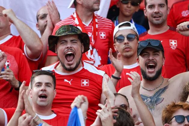 Schweizer Fanblock, rot gekleidete Fans, Berlin, UEFA EURO, EM, Europameisterschaft,Fussball 2024, jubelnde Menge, begeisterte Anhänger, Sicherheitsdienst, Sommer, festliche Atmosphäre, Fans in Rot, Fußballbegeisterung, Zuschauertribüne, Sportveranstaltung, Nationalmannschaft, Stadion, Leidenschaft, jubelnde Fans, Emotionen, Teamunterstützung, Fußballtrikots , Fussball, UEFA , Europa Meisterschaft, (Achtelfinale) 2024, Schweiz vs. Italien, 29.06.2024, Olympiastadion Berlin, Berlin, Deutschland Berlin Olympiastadion Berlin Berlin Deutschland Copyright: xGrantxHubbsx