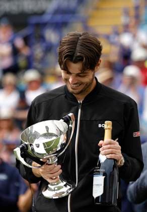 29th June 2024; Devonshire Park, Eastbourne, East Sussex, England: Rothesay International Eastbourne, Day 6; Taylor Fritz (USA) celebrates with the trophy after winning the mens singles final match against Max Purcell (AUS)  ActionPlus12661544 HongboxChen