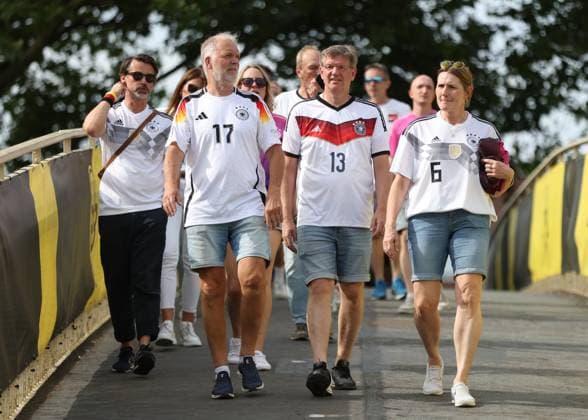 Dortmund, Germany, 29th June 2024. German fans arriving early to join in the atmosphere before the UEFA European Championships Group 16 match at the BVB Stadion, Dortmund. Picture credit should read: Paul Terry Sportimage EDITORIAL USE ONLY. No use with unauthorised audio, video, data, fixture lists, club league logos or live services. Online in-match use limited to 120 images, no video emulation. No use in betting, games or single club league player publications. SPI-3213-0004
