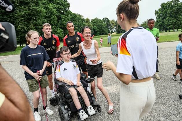 Belgium s Timothy Castagne and Belgium s Youri Tielemans take a selfie picture with some fans, during an informal press moment of some players of Belgian national soccer team Red Devils, Saturday 29 June 2024 at their base camp in Freiberg am Neckar, Germany, during the UEFA EURO, EM, Europameisterschaft,Fussball 2024 European Soccer Championships. On Monday the Red Devils will meet France in the Round of 16. BRUNOxFAHY  x95499041x