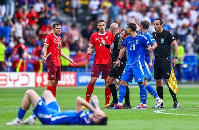 Fabian Schär of Switzerland and Remo Freuler are confronted by angry Italian players on the final whistle Switzerland v Italy, UEFA European Championship, EM, Europameisterschaft 2024, Round of 16, Football, Olympiastadion, Berlin, Germany - 29 Jun 2024 EDITORIAL USE ONLY No use with unauthorised audio, video, data, fixture lists, club league logos or live services. Online in-match use limited to 120 images, no video emulation. No use in betting, games or single club league player publications. Copyright: xMichaelxZemanek Shutterstockx 14562039bu