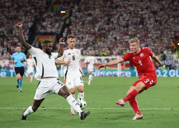 Dortmund, Germany, 29th June 2024. Rasmus Hojlund of Denmark takes a shot which is blocked by Antonio Rudiger of Germany during the UEFA European Championships Group 16 match at the BVB Stadion, Dortmund. Picture credit should read: Paul Terry Sportimage EDITORIAL USE ONLY. No use with unauthorised audio, video, data, fixture lists, club league logos or live services. Online in-match use limited to 120 images, no video emulation. No use in betting, games or single club league player publications. SPI-3213-0038