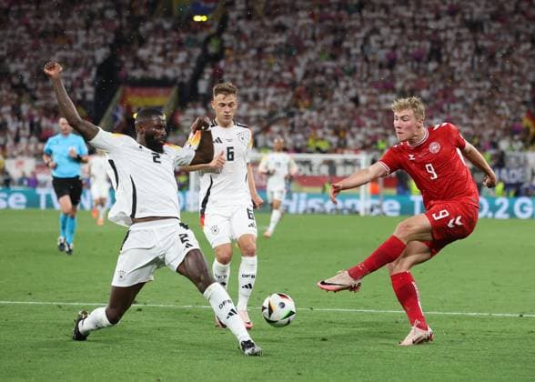 Dortmund, Germany, 29th June 2024. Rasmus Hojlund of Denmark takes a shot which is blocked by Antonio Rudiger of Germany during the UEFA European Championships Group 16 match at the BVB Stadion, Dortmund. Picture credit should read: Paul Terry Sportimage EDITORIAL USE ONLY. No use with unauthorised audio, video, data, fixture lists, club league logos or live services. Online in-match use limited to 120 images, no video emulation. No use in betting, games or single club league player publications. SPI-3213-0039