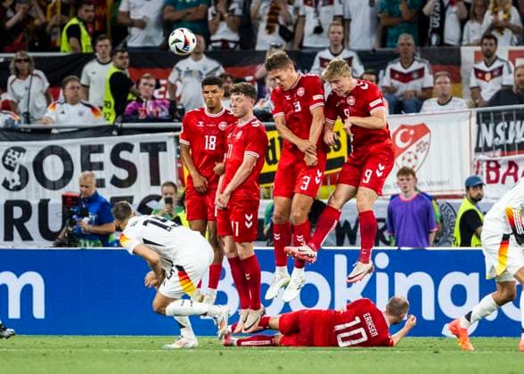 Dortmund, Signal Iduna Park, 29.06.2024: Wall of Denmark hold during the match UEFA European Championship, EM, Europameisterschaft 2024 Germany v. Denmark.