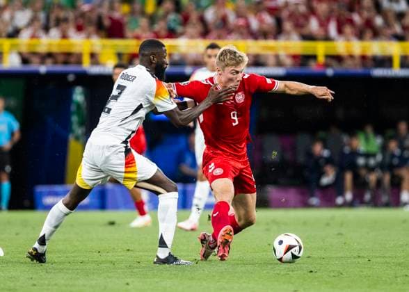Dortmund, Signal Iduna Park, 29.06.2024: Antonio Ruediger of germany challenges Rasmus Hoejlund of denmark during the match UEFA European Championship, EM, Europameisterschaft 2024 Germany v. Denmark.