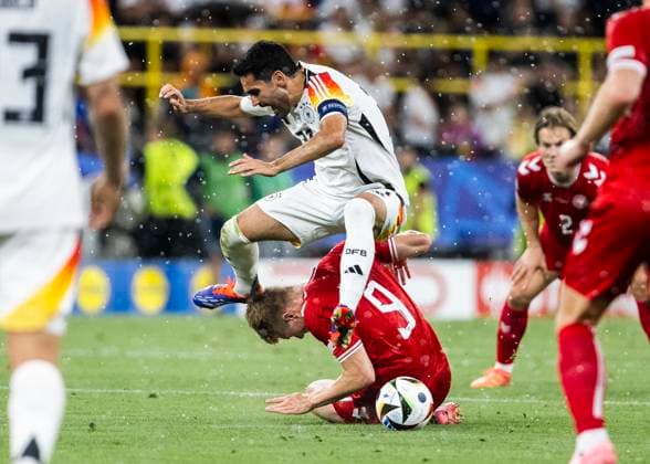 Dortmund, Signal Iduna Park, 29.06.2024: Ilkay Guendogan of germany challenges Rasmus Hoejlund of denmark during the match UEFA European Championship, EM, Europameisterschaft 2024 Germany v. Denmark.