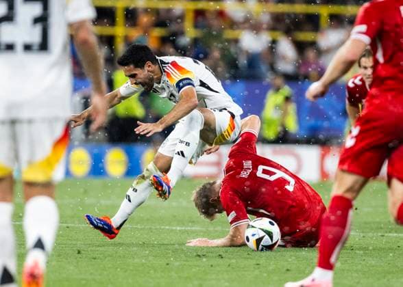 Dortmund, Signal Iduna Park, 29.06.2024: Ilkay Guendogan of germany challenges Rasmus Hoejlund of denmark during the match UEFA European Championship, EM, Europameisterschaft 2024 Germany v. Denmark.