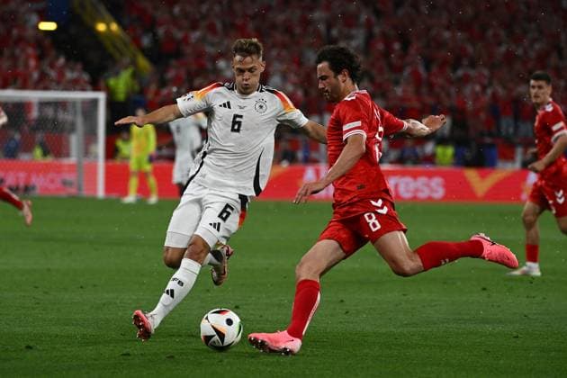 29.06.2024, xpsx, Fussball EM 2024 1 8 Finale, Deutschland - Dänemark emspor, v.l. Joshua Kimmich (Deutsche Fussball Nationalmannschaft DFB) Thomas Joseph Delaney (Dänemark Daenemark) Zweikampf, Aktion, action, battle for the ball (DFL DFB REGULATIONS PROHIBIT ANY USE OF PHOTOGRAPHS as IMAGE SEQUENCES and or QUASI-VIDEO) Dortmund