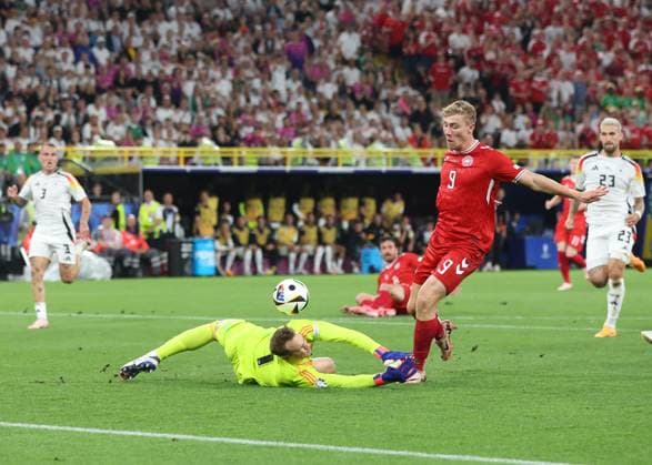 Dortmund, Germany, 29th June 2024. Manuel Neuer of Germany saves from a clean through Rasmus Hojlund of Denmark during the UEFA European Championships Group 16 match at the BVB Stadion, Dortmund. Picture credit should read: Paul Terry Sportimage EDITORIAL USE ONLY. No use with unauthorised audio, video, data, fixture lists, club league logos or live services. Online in-match use limited to 120 images, no video emulation. No use in betting, games or single club league player publications. SPI-3213-0054