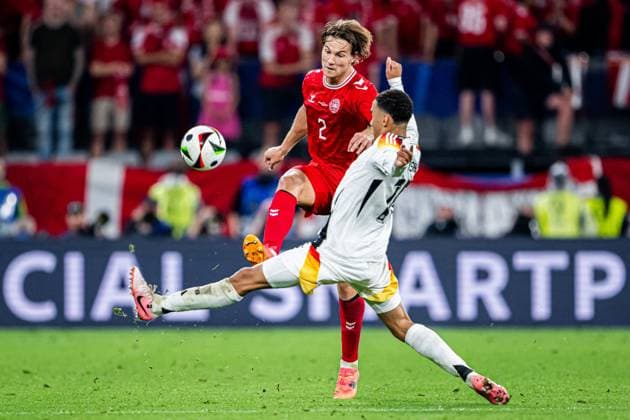240629 Joachim Andersen of Denmark and Jamal Musiala of Germany during the UEFA EURO, EM, Europameisterschaft,Fussball 2024 Football Championship round of 16 match between Germany and Denmark on June 29, 2024 in Dortmund. Photo: Jesper Zerman BILDBYRAN kod JZ JZ0545 fotboll football soccer fotball fotbolls-em europamästerskap em uefa euro uefa european football championship euro 2024 tyskland germany danmark denmark bbeng Copyright: JESPERxZERMAN BB240629JZ116