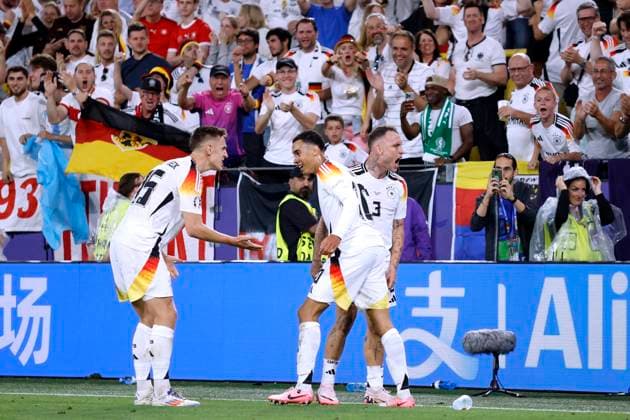 MUSIALA Jamal Team Deutschland jubelt nach seinem Tor zum 2 : 0 Endstand mit SCHLOTTERBECK Nico und RAUM David UEFA Fussball EURO 2024 in Deutschland Achtelfinale Spiel Deutschland - Daenemark 2 : 0 am 29.06.2024 in Dortmund DFL REGULATIONS PROHIBIT ANY USE OF PHOTOGRAPHS as IMAGE SEQUENCES and or QUASI-VIDEO Copyright: xLacixPerenyix