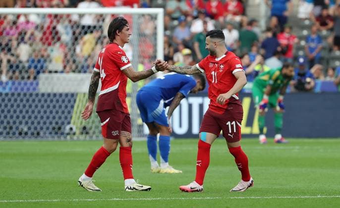 Steven Zuber jubelt nach Spielende mit Renato Steffen Freude Emotion Jubel Fußball Fussball Europameisterschaft Euro 2024 EM Herren Saison 2023 2024 29.06.2024 Schweiz SUI vs. Italien ITA in Berlin DFL regulations prohibit any use of photographs as image sequences and or quasi-video.