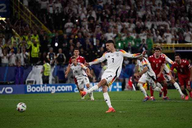 (240630) -- DORTMUND, June 30, 2024 -- Kai Havertz (front) of Germany shoots the penalty during the UEFA EURO, EM, Europameisterschaft,Fussball 2024 Round of 16 match between Germany and Denmark in Dortmund, Germany, June 29, 2024. ) (SP)GERMANY-DORTMUND-FOOTBALL-EURO 2024-GERMANY VS DENMARK XiaoxYijiu 