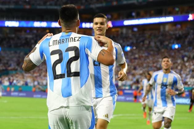 Argentina s forward Lautaro Martinez (L) celebrates with teammate Argentina s forward Valentin Carboni (C) after scoring the team™s second goal against Peru during the Copa America USA 2024, group A match between Argentina and Peru, at Hard Rock stadium in Miami, on June 29, 2024. MIAMI UNITED STATES Copyright: xALEJANDROxPAGNIx