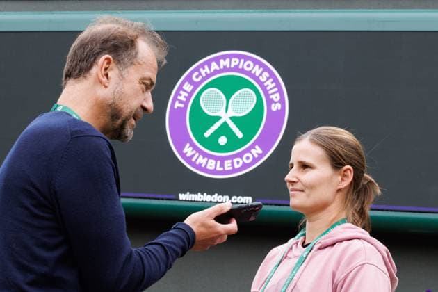 Belgian Greet Minnen is interviewed by former Belgian player Filip Dewulf prior to a training session during preparations ahead of the 2024 Wimbledon grand slam tennis tournament at the All England Tennis Club, in south-west London, Britain, Sunday 30 June 2024. BENOITxDOPPAGNE  x95551498x