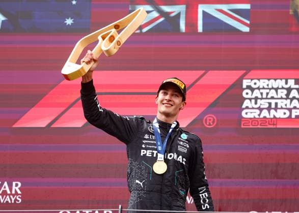 FORMULA 1 - GP of Austria 2024 SPIELBERG,AUSTRIA,30.JUN.24 - MOTORSPORTS, FORMULA 1 - Grand Prix of Austria, Red Bull Ring, award ceremony. Image shows the rejoicing of George Russell (GBR Mercedes). Keywords: trophy.  GEPAxpictures xDanielxGoetzhaber