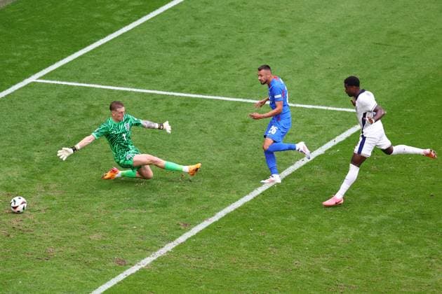 England v Slovakia 30 June 2024, Gelsenkirchen - UEFA EUROs - Round of 16 - England v Slovakia - Ivan Schranz of Slovakia scores the opening goal of the match by beating England goalkeeper Jordan Pickford and defender Marc Guehi - Photo: Charlotte Wilson Offside. Gelsenkirchen Germany Copyright: xCharlottexWilsonx xOffsidexOffside