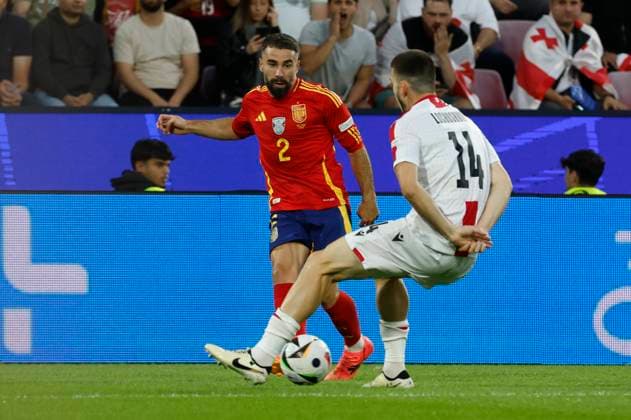 Spain s Dani Carvajal (L) in action against Georgia s Luka Lochoshvili (R) during the Euro2024 round of 16 soccer match between Spain and Georgia at RheinEnergieStadion in Cologne, Germany, 30 June 2024. Spain vs. Georgia !ACHTUNG: NUR REDAKTIONELLE NUTZUNG!  Copyright: xJ.J.Guillenx GRAF9881 20240630-55014023065_1