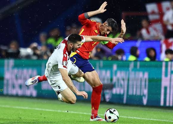 Luka Lochoshvili of Georgia is fouled by Ãlvaro Morata of Spain Spain v Georgia, UEFA European Championship, EM, Europameisterschaft 2024, Round of 16, Football, Cologne Stadium, Cologne, Germany - 30 Jun 2024 EDITORIAL USE ONLY No use with unauthorised audio, video, data, fixture lists, club league logos or live services. Online in-match use limited to 120 images, no video emulation. No use in betting, games or single club league player publications.  Copyright: xMichaelxZemanek Shutterstockx 14562306x