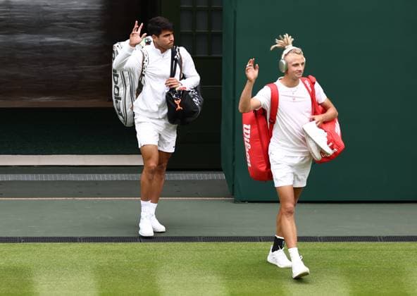 Carlos Alcaraz of Spain and Mark Lajal of Estonia enter Centre Court Wimbledon Tennis Championships, Day 1, The All England Lawn Tennis and Croquet Club, London, UK - 01 Jul 2024  Copyright: xJamesxMarsh Shutterstockx 14565034ah