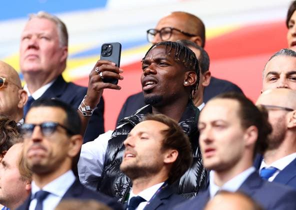 French footballer, Paul Pogba takes photos from the stands prior to kick off France v Belgium, UEFA European Championship, EM, Europameisterschaft 2024, Round of 16, Football, Dusseldorf Arena, Dusseldorf, Germany - 01 Jul 2024 EDITORIAL USE ONLY No use with unauthorised audio, video, data, fixture lists, club league logos or live services. Online in-match use limited to 120 images, no video emulation. No use in betting, games or single club league player publications. Copyright: xKieranxMcManus Shutterstockx 14566634ag