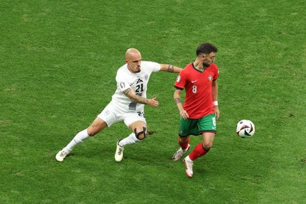 Bruno Fernandes of Portugal and Vanja Drkusic of Slovenia Portugal v Slovenia, UEFA European Championship, EM, Europameisterschaft 2024, Round of 16, Football, Frankfurt Arena, Frankfurt, Germany - 01 Jul 2024 EDITORIAL USE ONLY No use with unauthorised audio, video, data, fixture lists, club league logos or live services. Online in-match use limited to 120 images, no video emulation. No use in betting, games or single club league player publications.  Copyright: xPaulxCurrie Shutterstockx 14566636aa