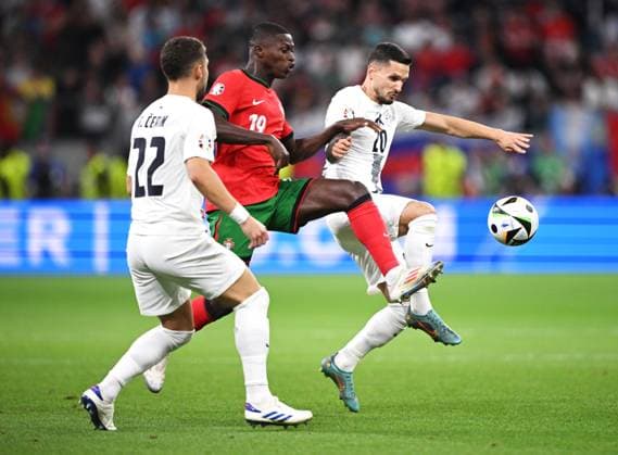 Germany Soccer Euro 2024 Portugal - Slovenia 8720729 01.07.2024 From left, Slovenia s Adam Gnezda Cerin, Portugal s Nuno Mendes and Slovenia s Petar Stojanovic struggle for a ball during the UEFA EURO, EM, Europameisterschaft,Fussball 2024 round of 16 soccer match between Portugal and Slovenia at the Frankfurt Arena in Frankfurt am Main, Germany. Alexey Filippov Sputnik Germany  Copyright: xAlexeyxFilippovx