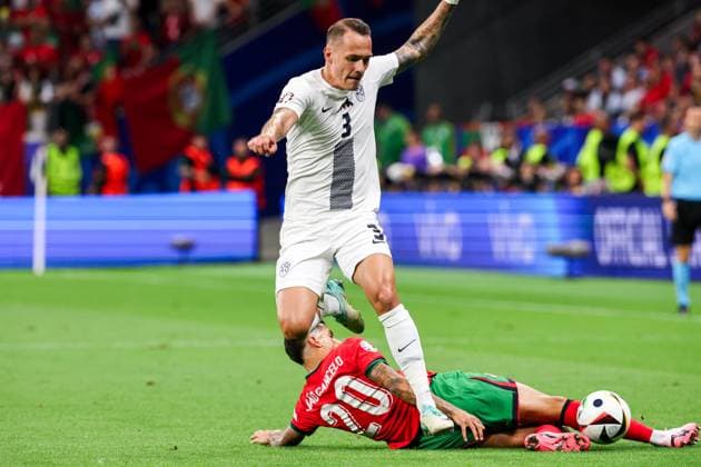 2024-07-01 Portugal v Slovenia - Round of 16 - UEFA EURO, EM, Europameisterschaft,Fussball 2024 FRANKFURT, GERMANY - JULY 1: Joao Cancelo of Portugal battles for possession with Jure Balkovec of Slovenia during the Round of 16 - UEFA EURO 2024 match between Portugal and Slovenia at Deutsche Bank Park on July 1, 2024 in Frankfurt, Germany. (Photo by Peter Lous BSR Agency) Frankfurt Germany Content not available for redistribution in The Netherlands directly or indirectly through any third parties. Copyright: xBSRxAgencyx