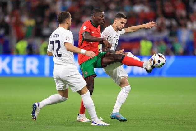 Football - UEFA EURO, EM, Europameisterschaft,Fussball 2024 - Round of 16 - Portugal v Slovenia 1st July 2024 - UEFA EURO 2024 - Round of 16 - Portugal v Slovenia - Nuno Mendes of Portugal and Petar Stojanovic of Slovenia - Photo: Simon Stacpoole Offside. Frankfurt Germany Copyright: xSimonxStacpoolexOffside