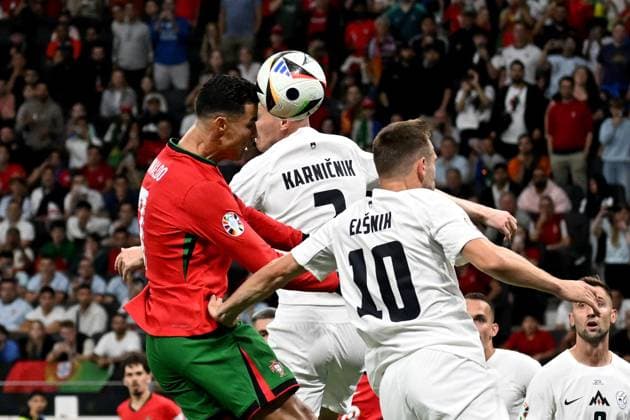 01.07.2024, xjhx, Fussball EM 2024 1 8 Finale, Portugal - Slowenien emspor, v.l. Cristiano Ronaldo (Portugal) Zan Karnicnik (Slowenien) Timi Elsnik (Slowenien) Zweikampf, Aktion, action, battle for the ball (UEFA REGULATIONS PROHIBIT ANY USE OF PHOTOGRAPHS as IMAGE SEQUENCES and or QUASI-VIDEO) Frankfurt am Main
