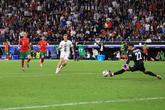 Sport Bilder des Tages Football - UEFA EURO, EM, Europameisterschaft,Fussball 2024 - Round of 16 - Portugal v Slovenia 1st July 2024 - UEFA EURO 2024 - Round of 16 - Portugal v Slovenia - Portugal goalkeeper Diego Costa saves a shot from Benjamin Sesko of Slovenia - Photo: Simon Stacpoole Offside. Frankfurt Germany Copyright: xSimonxStacpoolexOffside