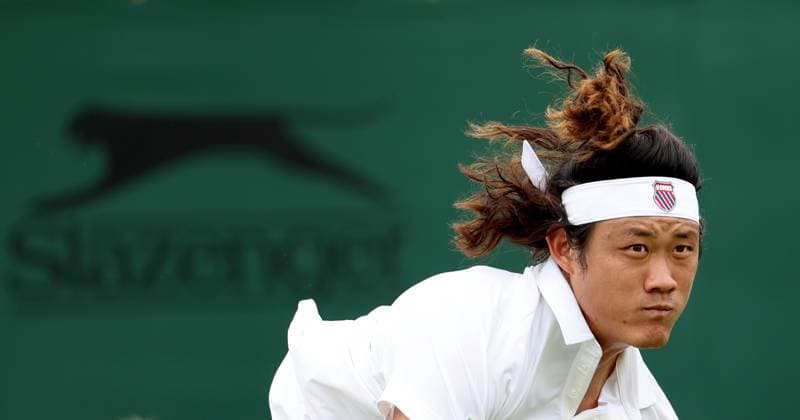 (240702) -- LONDON, July 2, 2024 -- Zhang Zhizhen serves during the men s singles first round match between Zhang Zhizhen of China and Maxime Janvier of France at Wimbledon tennis Championship in London, Britain, on July 1, 2024. ) (SP)BRITAIN-LONDON-TENNIS-WIMBLEDON LixYing 