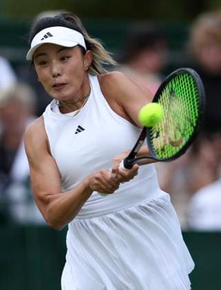 (240702) -- LONDON, July 2, 2024 -- Wang Qiang hits a return during the women s singles first round match between Wang Qiang of China and Emma Navarro of the United States at Wimbledon tennis Championship in London, Britain, on July 1, 2024. ) (SP)BRITAIN-LONDON-TENNIS-WIMBLEDON HanxYan 