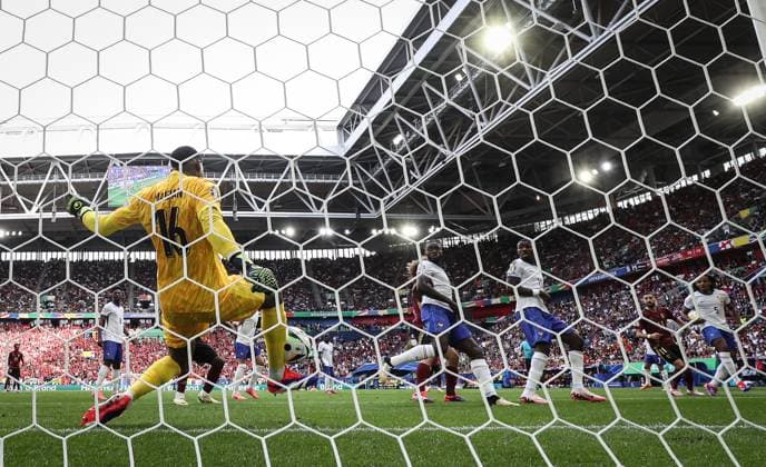 (240702) -- DUESSELDORF, July 2, 2024 -- France s goalkeeper Mike Maignan (L) saves the goal by Kevin De Bruyne of Belgium during the UEFA EURO, EM, Europameisterschaft,Fussball 2024 round of 16 match between France and Belgium in Duesseldorf, Germany on July 1, 2024. ) (SP)GERMANY-DUESSELDORF-FOOTBALL-EURO 2024-FRANCE VS BELGIUM PanxYulong 