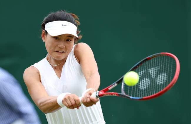 (240702) -- LONDON, July 2, 2024 -- Wang Yafan hits a return during the women s singles first round match between Wang Yafan of China and Anna Karolina Schmiedlova of Slovakia at Wimbledon tennis Championship in London, Britain, on July 1, 2024. ) (SP)BRITAIN-LONDON-TENNIS-WIMBLEDON LixYing 