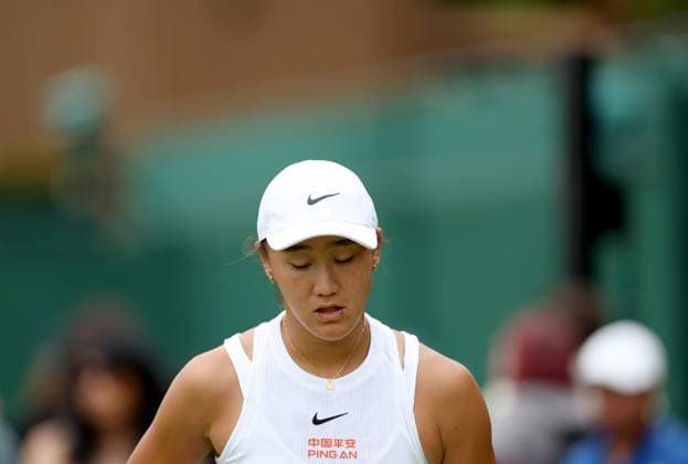 (240702) -- LONDON, July 2, 2024 -- Wang Xiyu reacts during the women s singles first round match between Wang Xiyu of China and Donna Vekic of Croatia at Wimbledon tennis Championship in London, Britain, on July 1, 2024. ) (SP)BRITAIN-LONDON-TENNIS-WIMBLEDON LixYing 