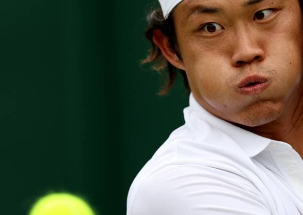 (240702) -- LONDON, July 2, 2024 -- Zhang Zhizhen eyes the ball during the men s singles first round match between Zhang Zhizhen of China and Maxime Janvier of France at Wimbledon tennis Championship in London, Britain, on July 1, 2024. ) (SP)BRITAIN-LONDON-TENNIS-WIMBLEDON LixYing 