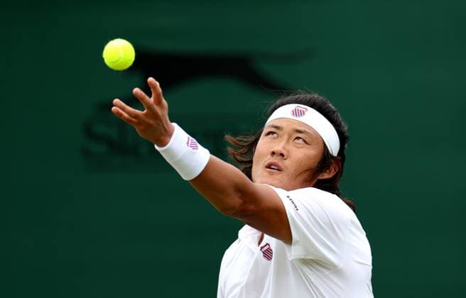 (240702) -- LONDON, July 2, 2024 -- Zhang Zhizhen serves during the men s singles first round match between Zhang Zhizhen of China and Maxime Janvier of France at Wimbledon tennis Championship in London, Britain, on July 1, 2024. ) (SP)BRITAIN-LONDON-TENNIS-WIMBLEDON LixYing 