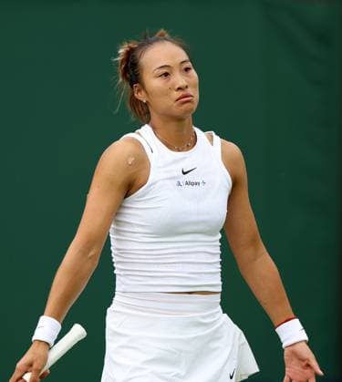 (240702) -- LONDON, July 2, 2024 -- Zheng Qinwen reacts during the women s singles first round match between Zheng Qinwen of China and Sun Lulu of New Zealand at Wimbledon tennis Championship in London, Britain, on July 1, 2024. ) (SP)BRITAIN-LONDON-TENNIS-WIMBLEDON LixYing 