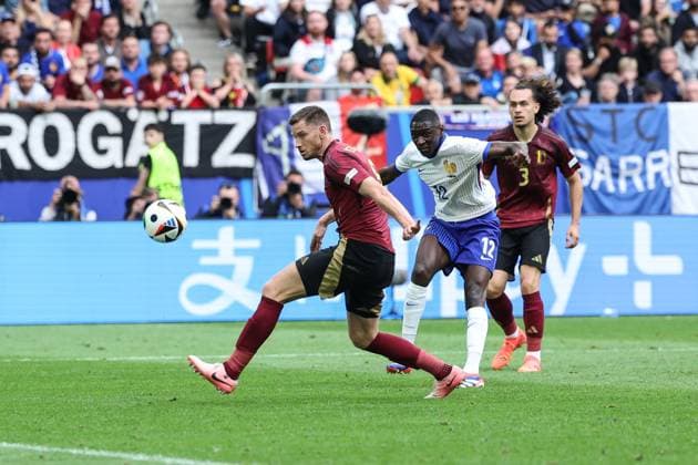(240702) -- DUESSELDORF, July 2, 2024 -- Randal Kolo Muani (C) of France shoots at goal and causes Belgium s Jan Vertonghen (L) to make an own goal during the UEFA EURO, EM, Europameisterschaft,Fussball 2024 round of 16 match between France and Belgium in Duesseldorf, Germany on July 1, 2024. ) (SP)GERMANY-DUESSELDORF-FOOTBALL-EURO 2024-FRANCE VS BELGIUM PanxYulong 