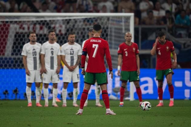 (240702) -- FRANKFURT, July 2, 2024 -- Cristiano Ronaldo (front) of Portugal gets ready to take a free kick during the UEFA EURO, EM, Europameisterschaft,Fussball 2024 Round of 16 match between Portugal and Slovenia in Frankfurt, Germany on July 1, 2024. ) (SP)GERMANY-FRANKFURT-FOOTBALL-EURO 2024-PORTUGAL VS SLOVENIA XiaoxYijiu 