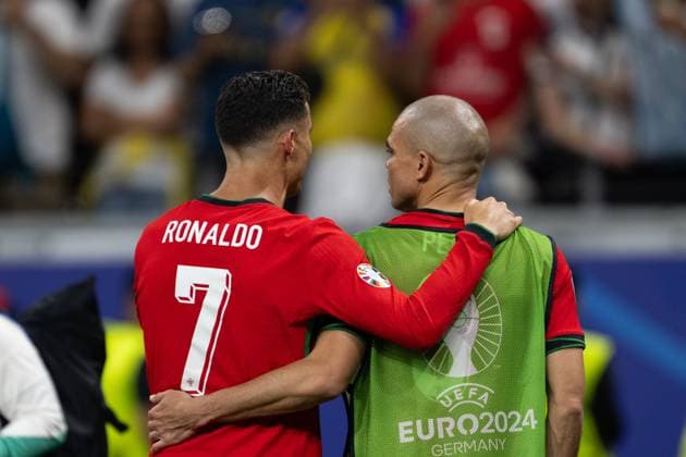 (240702) -- FRANKFURT, July 2, 2024 -- Pepe (R) and Cristiano Ronaldo Portugal hug after the UEFA EURO, EM, Europameisterschaft,Fussball 2024 Round of 16 match between Portugal and Slovenia in Frankfurt, Germany on July 1, 2024. ) (SP)GERMANY-FRANKFURT-FOOTBALL-EURO 2024-PORTUGAL VS SLOVENIA XiaoxYijiu 